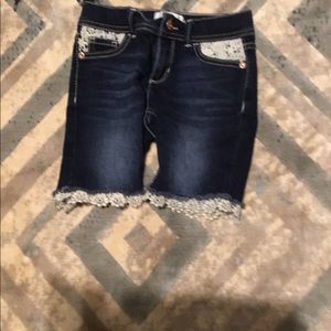 Dark denim shorts with white ruffles